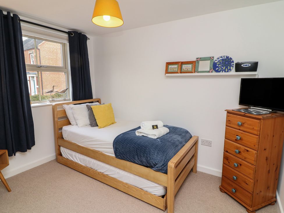 A bedroom with a single bed and television at No 39 Ashbourne