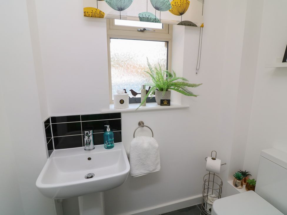 A bathroom with sink and toilet at No 39 Ashbourne