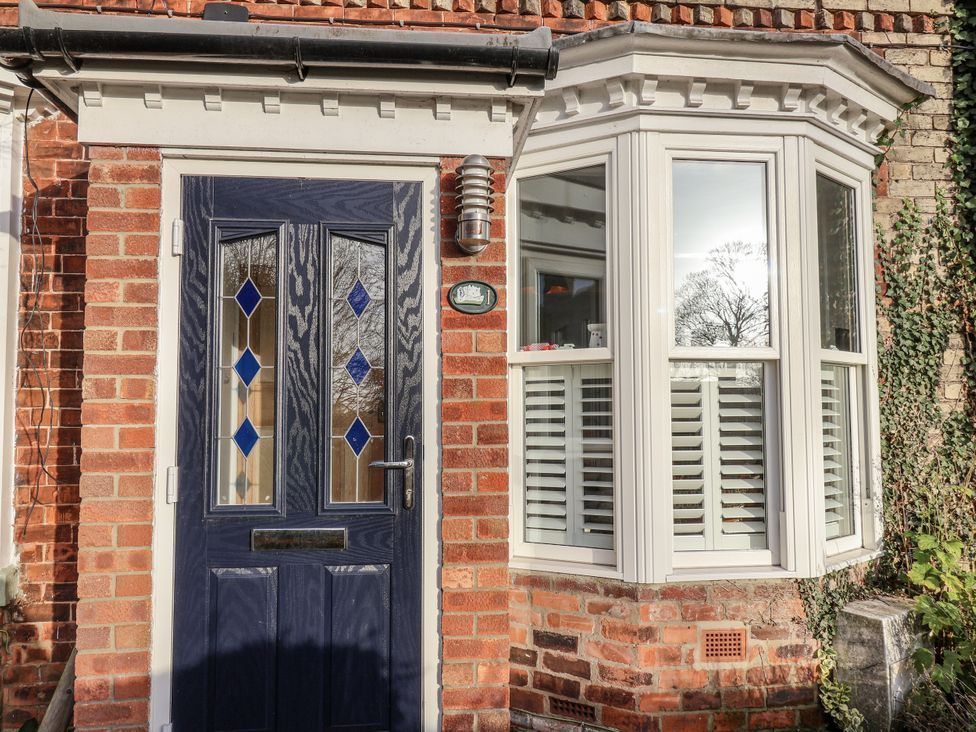 A front entrance with a door and window at 1 Castle Terrace
