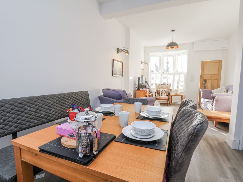 A dining room with a table set for meals at 1 Castle Terrace