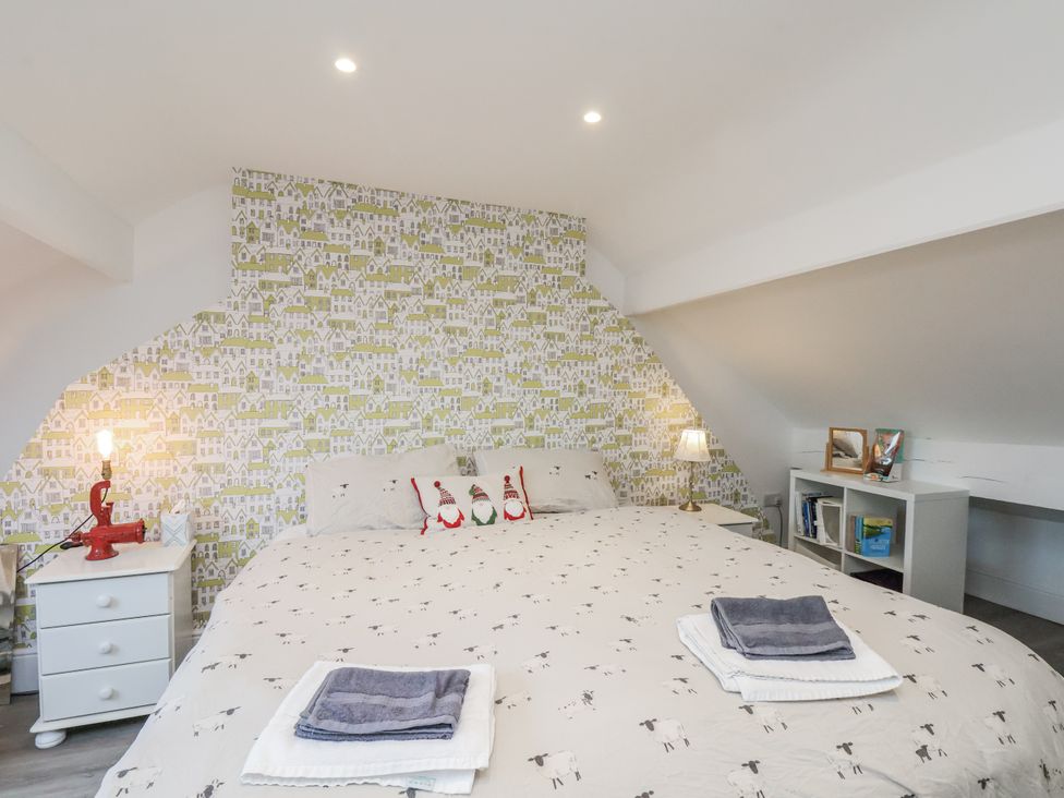 A bedroom with a bed and lamp at 1 Castle Terrace