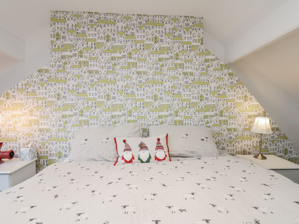 A bedroom with a bed and bedside table at 1 Castle Terrace