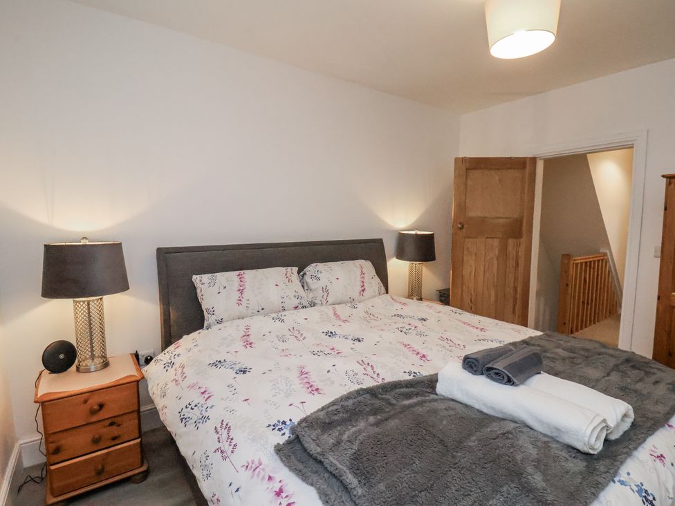 A bedroom with a bed and bedside table at 1 Castle Terrace in Thirsk