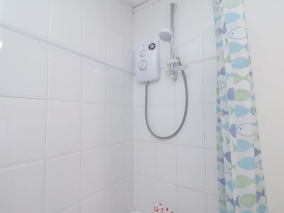 A shower setup with tiles and control at 1 Castle Terrace in Thirsk