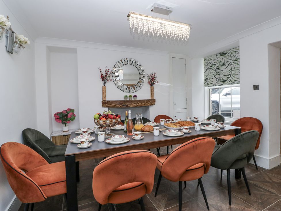 A dining room with a table set for a meal at Aspen Boutique