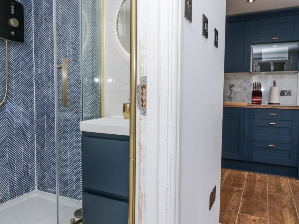 A bathroom with a shower and sink at Aspen Boutique in 