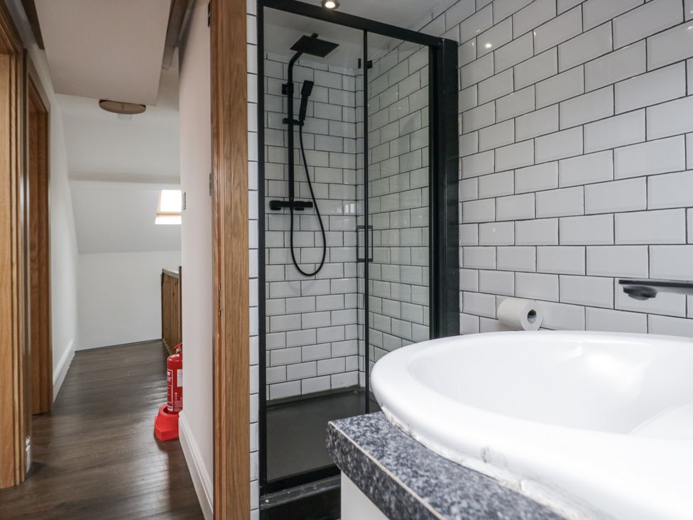 A bathroom with a shower and bathtub at Aspen Boutique 