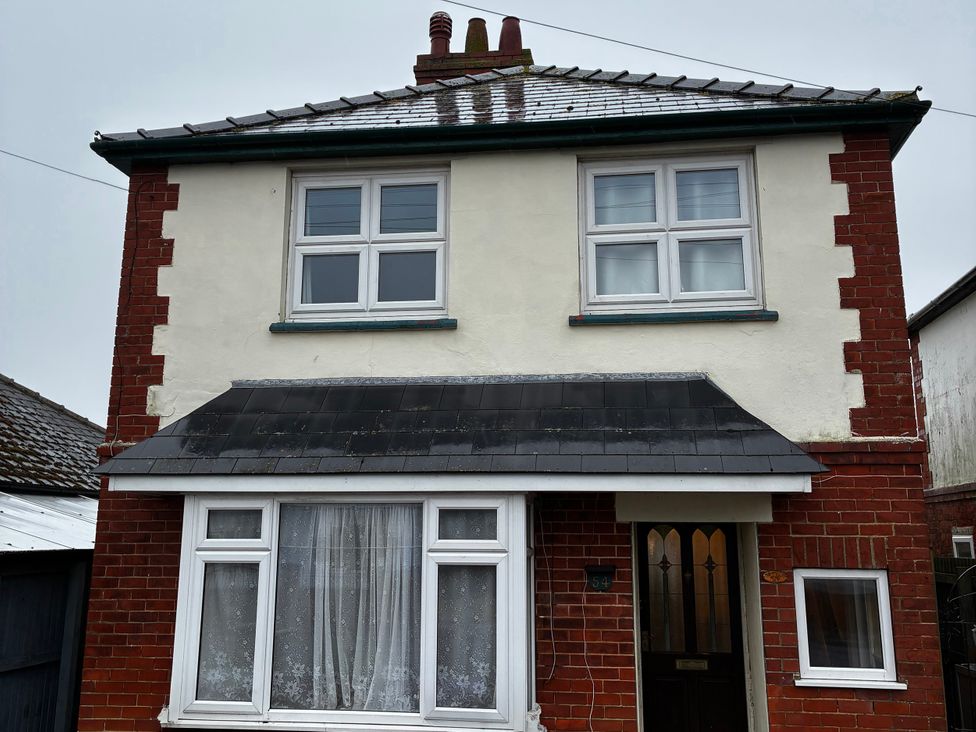 A house exterior with windows and a front door at 54 George Street