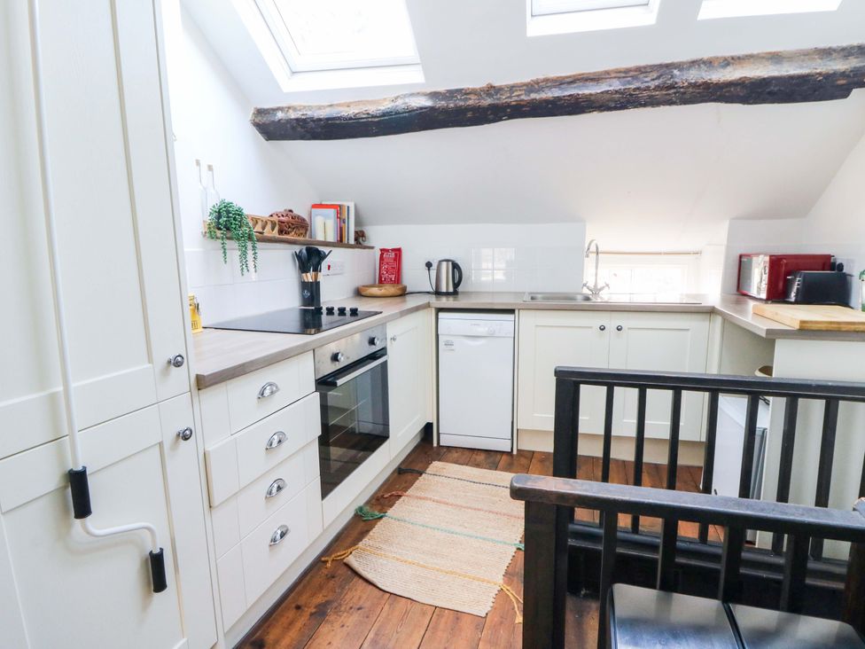 A kitchen with appliances and utensils at The Little Laura Ashley House in Machynlleth