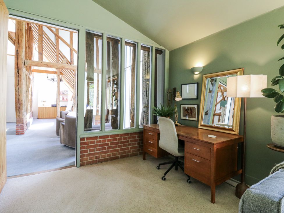 An office with a desk and chair at Headland Barn in Maldon