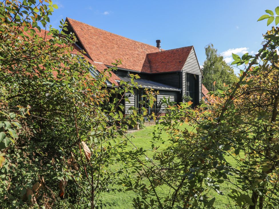 A house with a red roof and garden at Headland Barn in Maldon