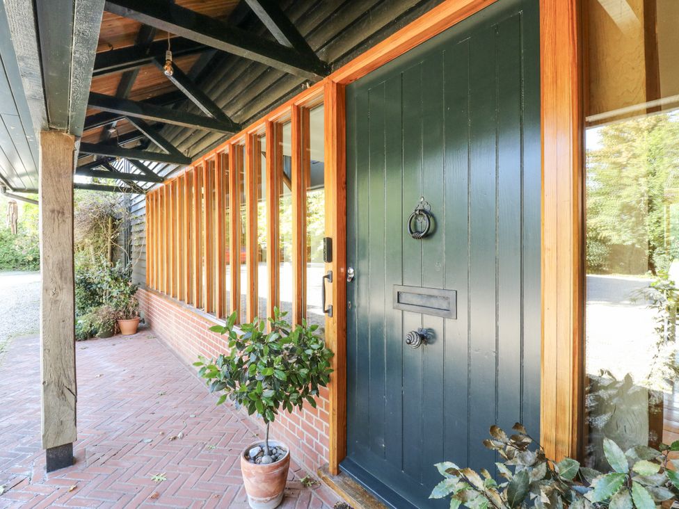 A front door with a planter by the entrance at Headland Barn in Maldon