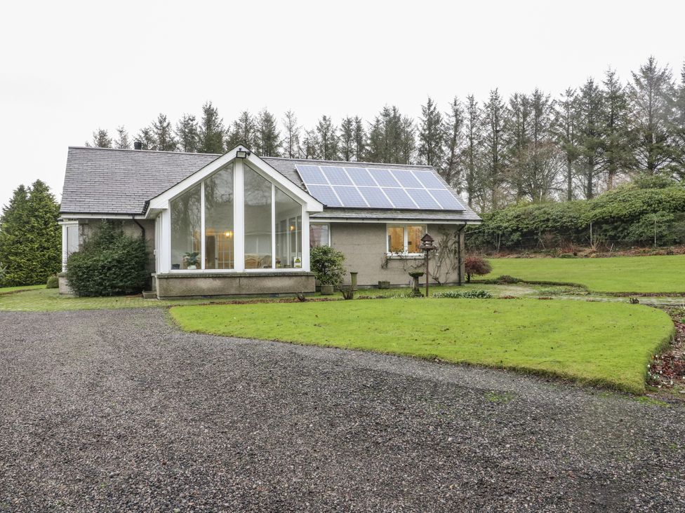A house with solar panels and a landscaped garden at Carnmhor in Aberdeen