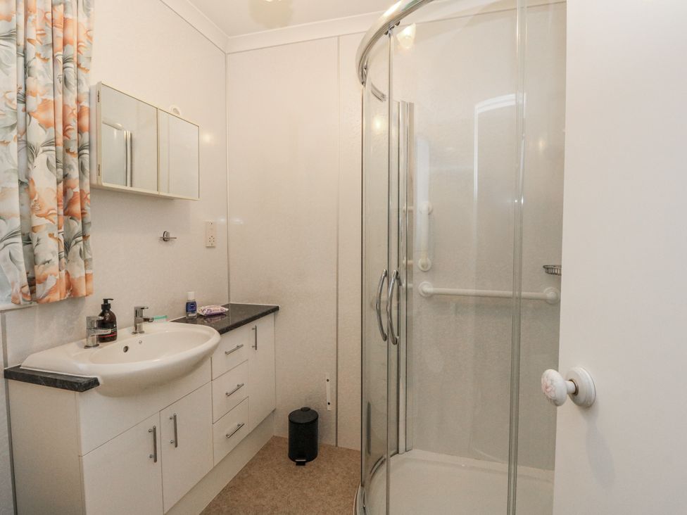 A bathroom with a shower and sink at Carnmhor in Aberdeen