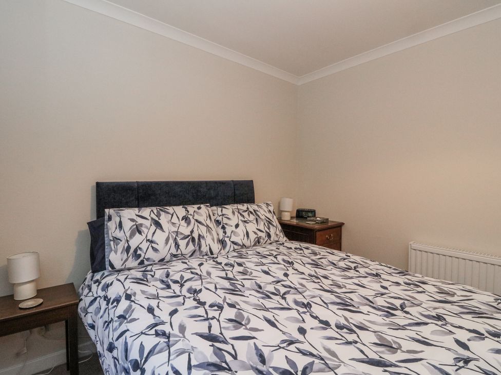 A bedroom with a bed and bedside table at Carnmhor in Aberdeen