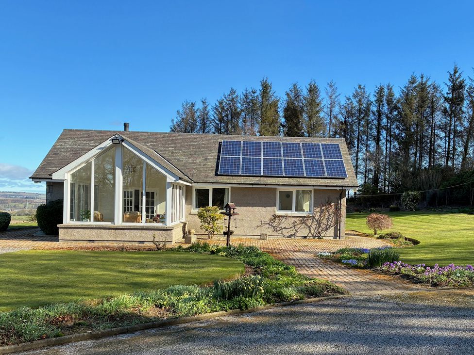 A house with solar panels and garden at Carnmhor Blackburn, Aberdeenshire