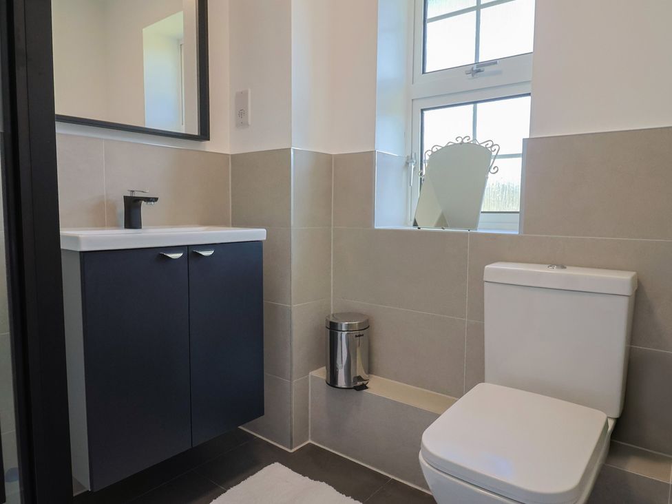 A bathroom with a sink and toilet at Oakwood in Chideock
