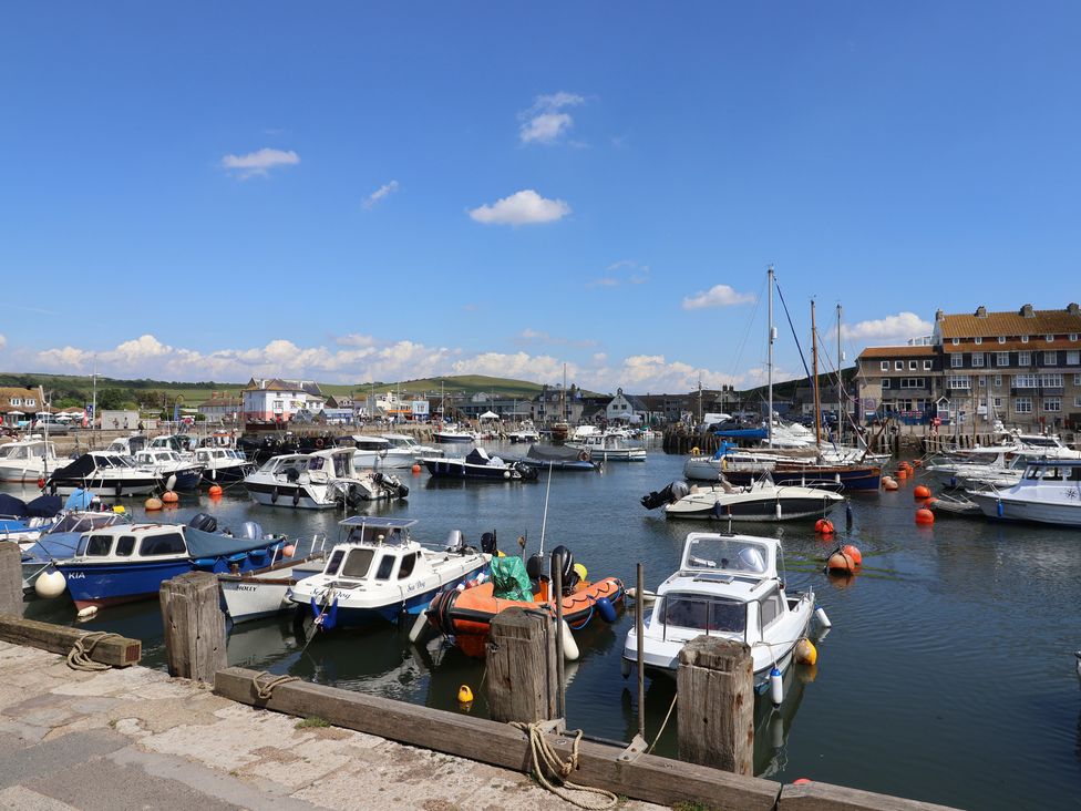 A harbor with boats and buildings at Oakwood in Chideock