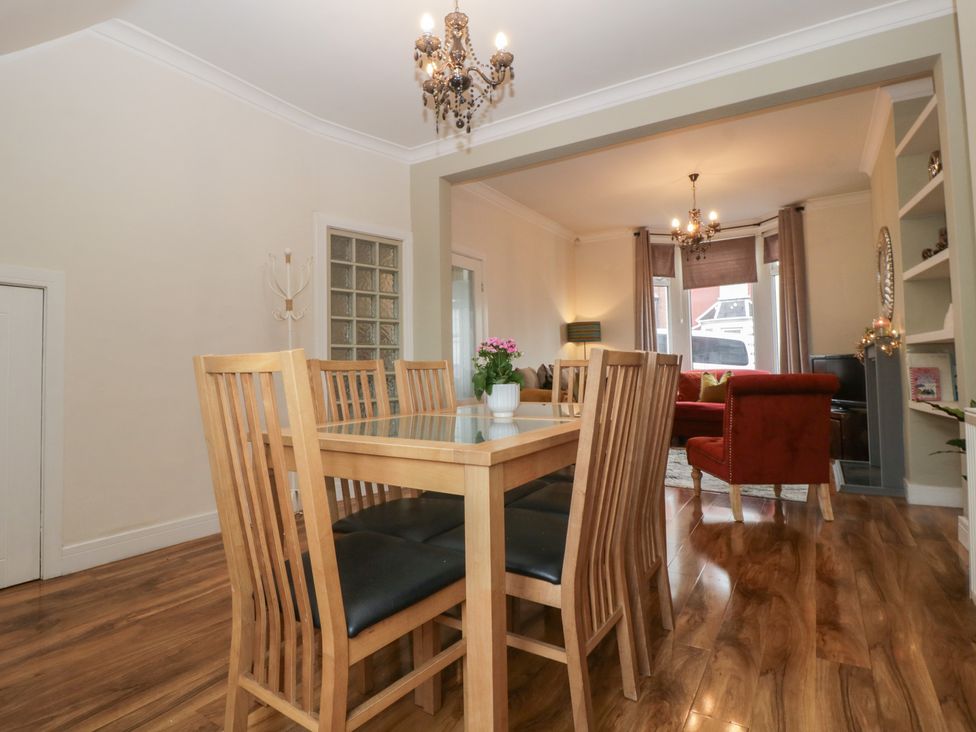 A dining room with a table and chairs at Gavin and Stacey House in Barry