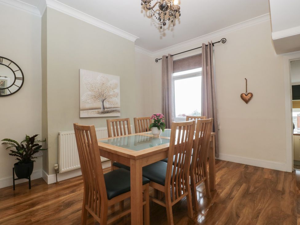 A dining room with a table and chairs at Gavin and Stacey House in Barry