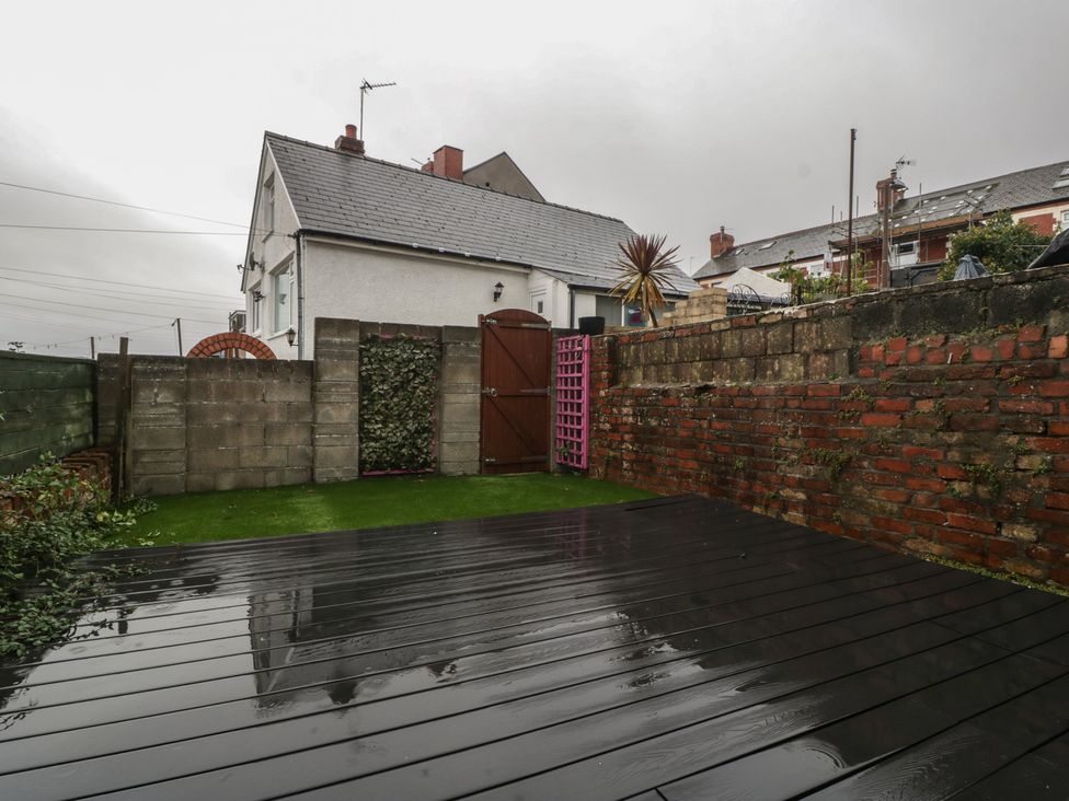 A garden with a house in the background at Gavin and Stacey House in Barry