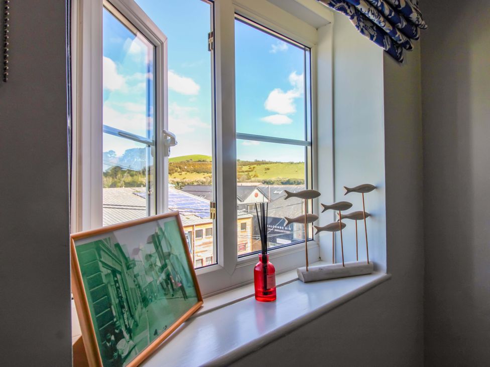 A window with a view and decorative items in Rockside Salcombe