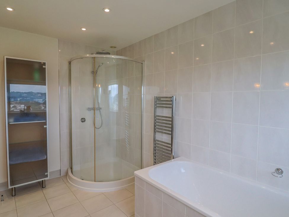 A bathroom with a shower and bathtub at Hawksdown in Lyme Regis