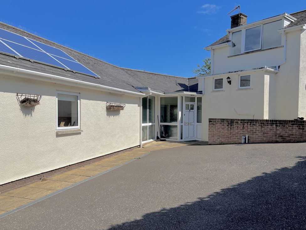 An outdoor area with solar panels on a house at Hawksdown Lyme Regis