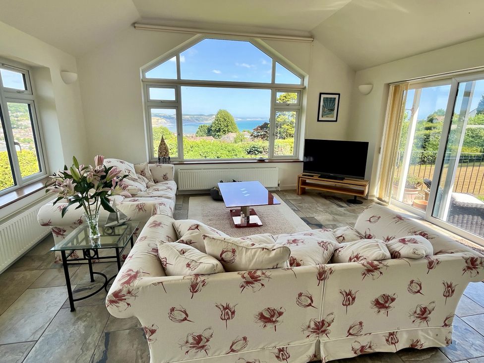 A living room with a view of the sea at Hawksdown in Lyme Regis