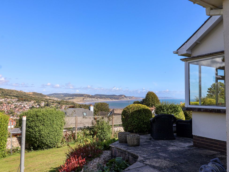 A garden with seating and views of the sea at Hawksdown in Lyme Regis