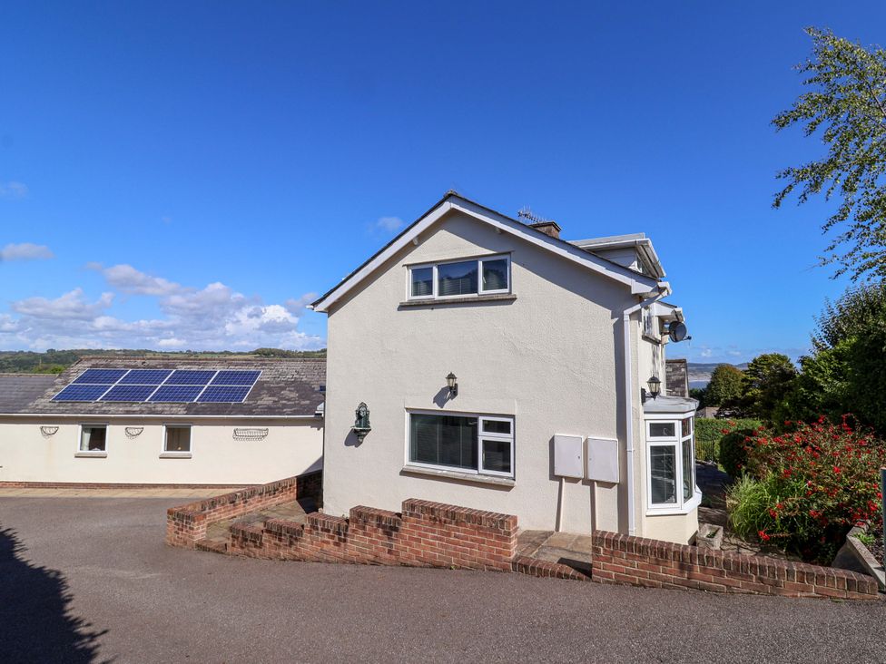 An exterior view of a house with solar panels at Hawksdown in Lyme Regis