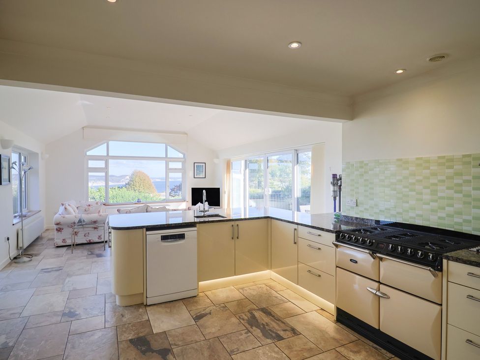 A kitchen with a stove and sink at Hawksdown in Lyme Regis