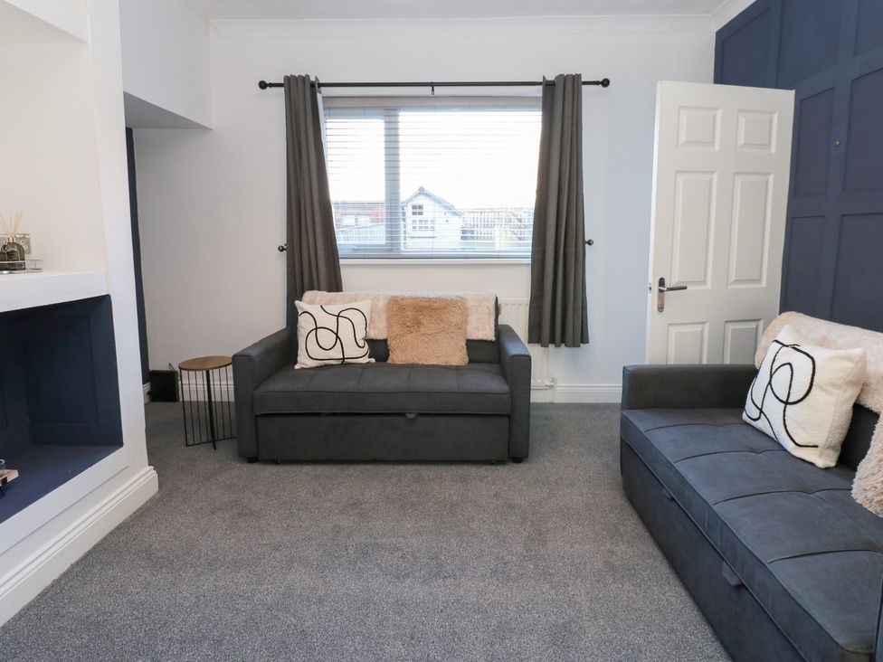 A living room with sofa and armchair at 16 Salvin Terrace Stockton-on-Tees