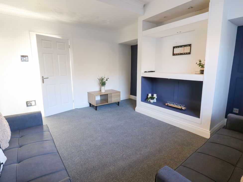 A living room with a sofa and a coffee table at 16 Salvin Terrace Stockton-on-Tees