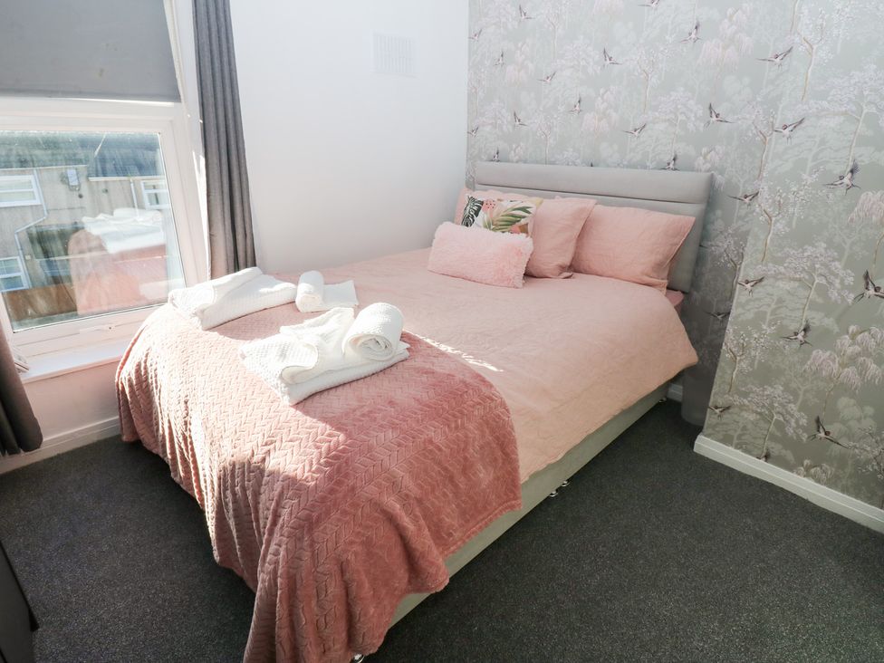 A bedroom with a bed and window at 16 Salvin Terrace Stockton-on-Tees