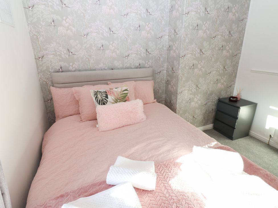 A bedroom with a bed and bedside table at 16 Salvin Terrace in Stockton-on-Tees
