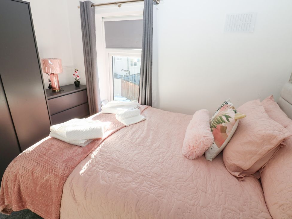 A bedroom with a bed and a dresser at 16 Salvin Terrace Stockton-on-Tees