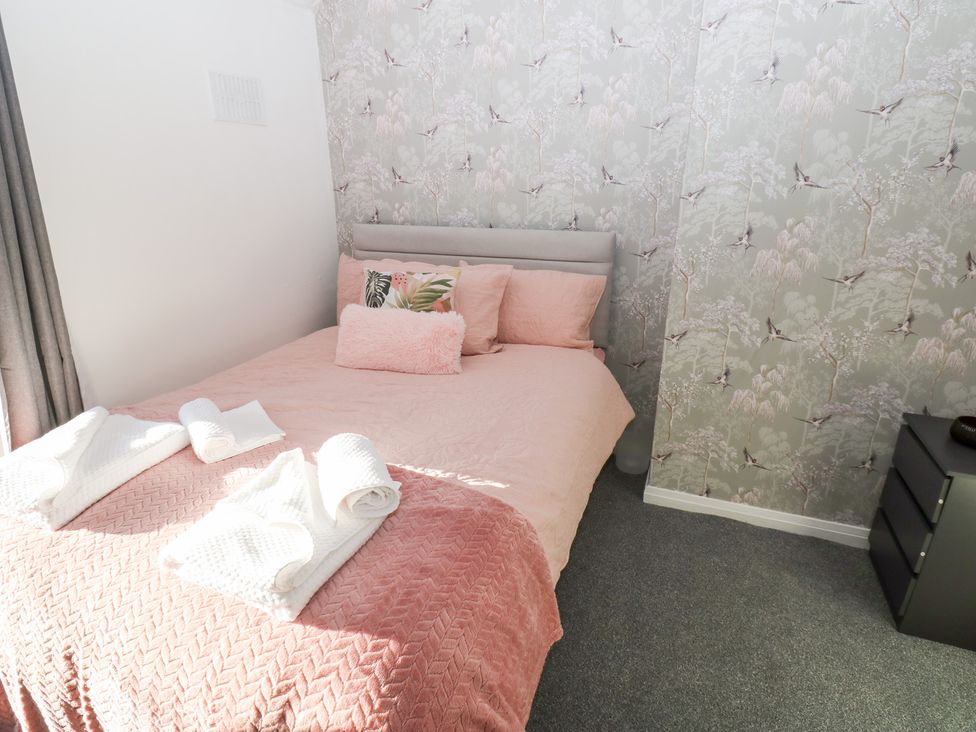 A bedroom with a bed and bedside table at 16 Salvin Terrace Stockton-on-Tees