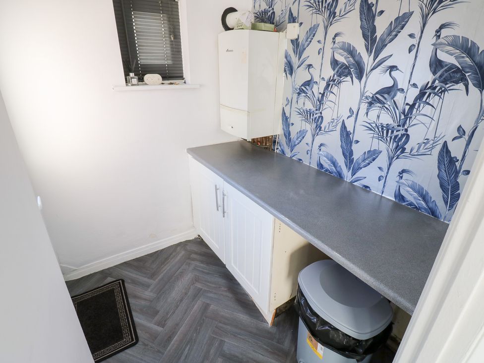 A utility room with a countertop and boiler at 16 Salvin Terrace in Stockton-on-Tees