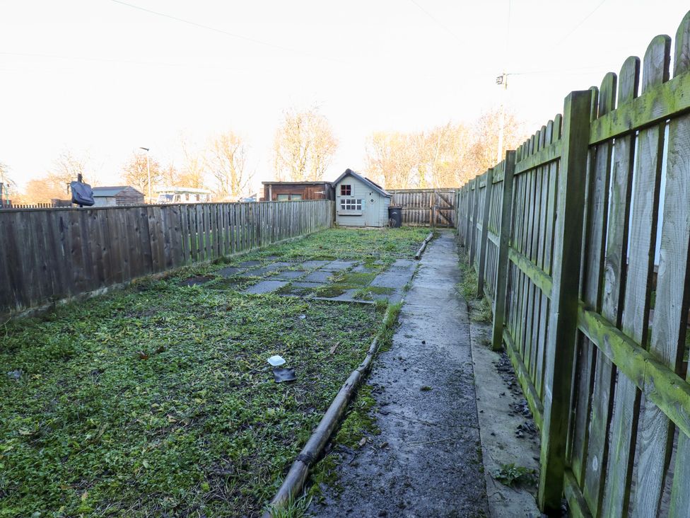 A garden with a path and shed at 16 Salvin Terrace Stockton-on-Tees