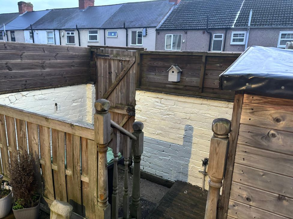 A garden area with a wooden gate and fence at 16 Salvin Terrace Fishburn