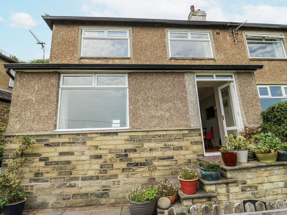 A house with windows and planters at The Vista in Hebden Bridge