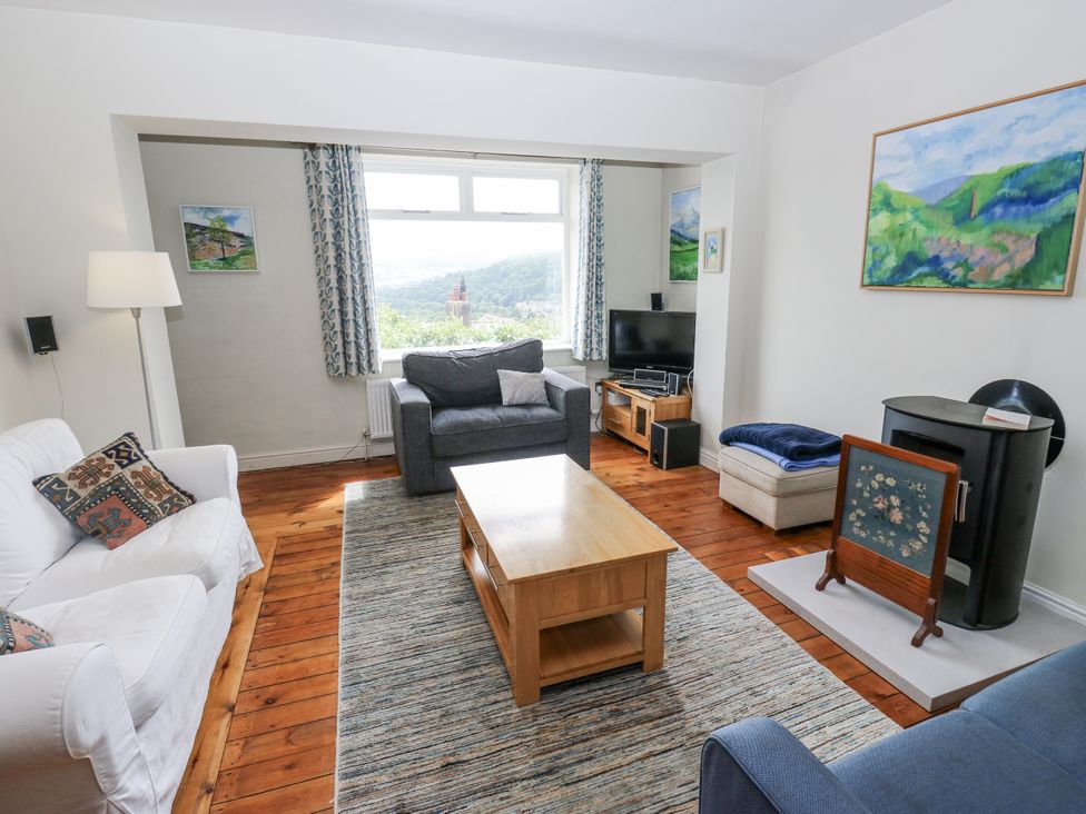 A living room with sofa and coffee table at The Vista in Hebden Bridge
