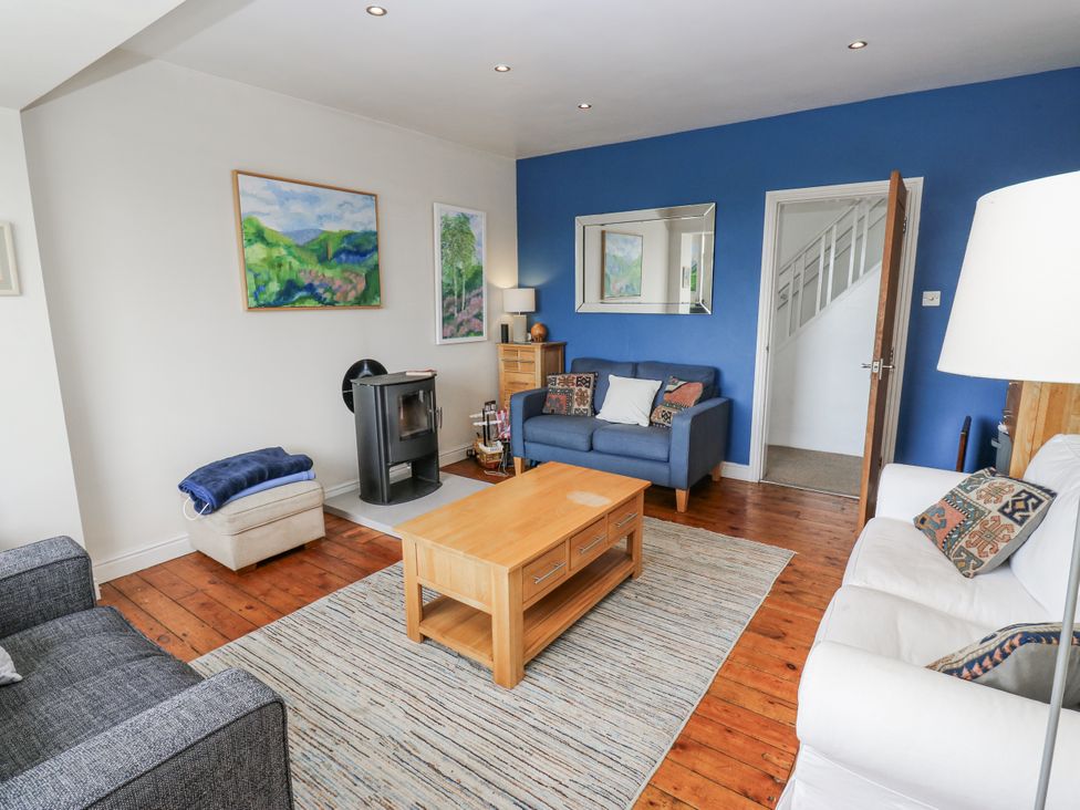 A living room with sofas and a coffee table at The Vista in Hebden Bridge