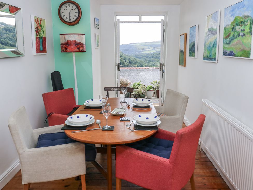 A dining room with a table set for meals at The Vista in Hebden Bridge