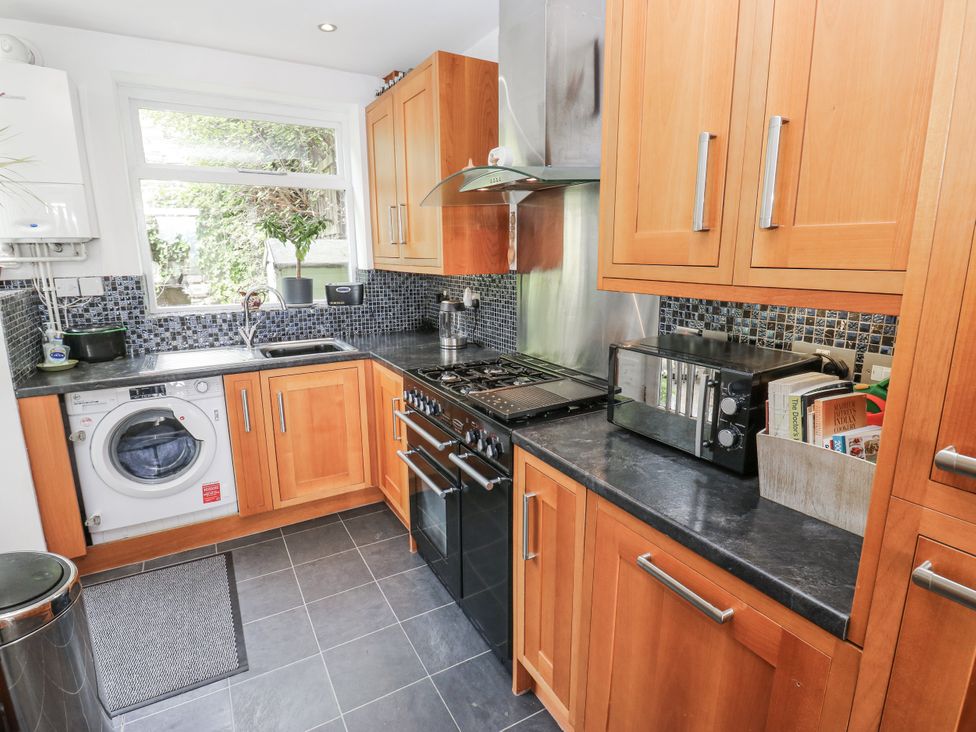 A kitchen with appliances and cabinets at The Vista in Hebden Bridge