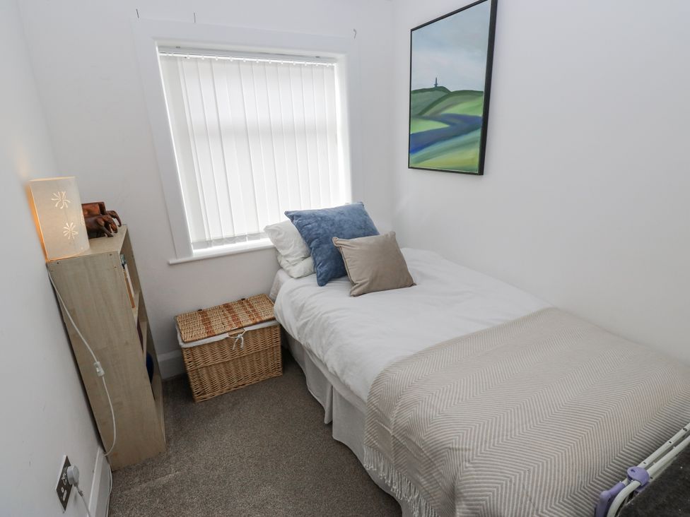 A bedroom with a bed and a window at The Vista in Hebden Bridge