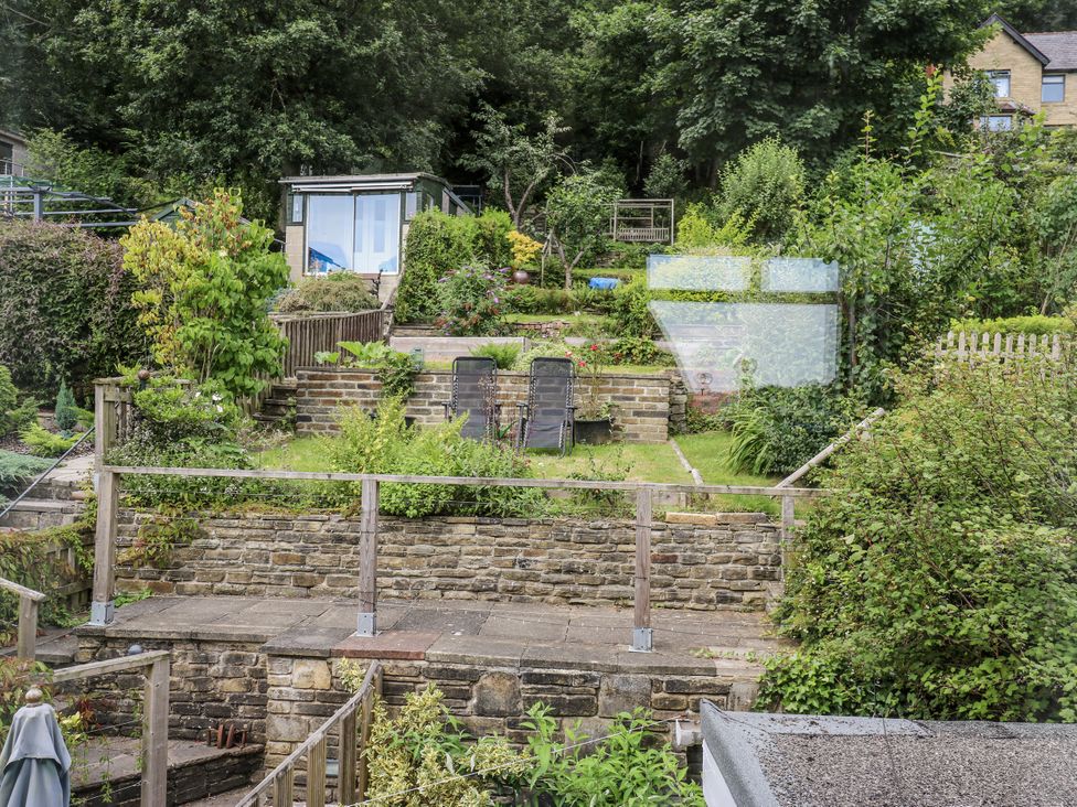 A garden with steps and chairs at The Vista in Hebden Bridge
