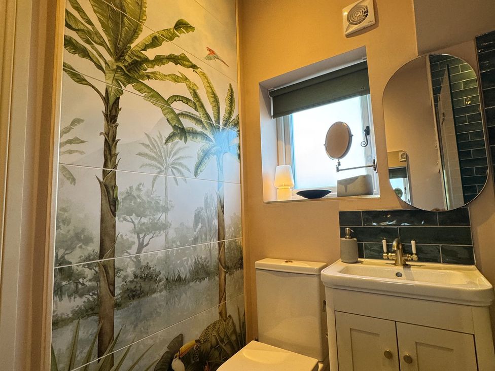 A bathroom with a sink and toilet at Bohemian Beach Cottage in Bournemouth