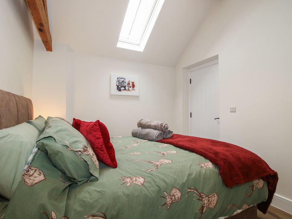 A bedroom with a bed and towels at Chestnut Barn Northwood near Wem